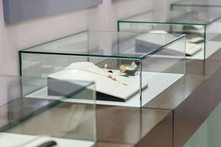 Jewelry in the showcase at jeweler's shop. Concept of wealth and luxurious lifeの写真素材