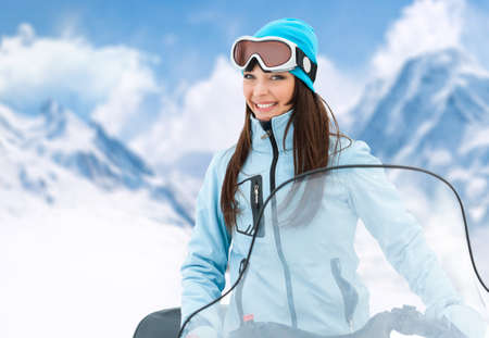 Portrait of woman on snowmobile.Concept of snow sport and healthy lifestyleの写真素材
