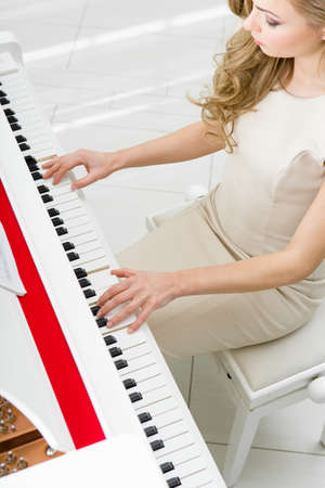 Top view of woman playing piano. Concept of music and artsの写真素材