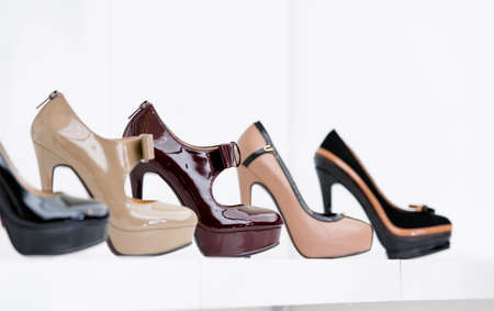 Close up of set of stylish shoes at the showcase in the shopping mall
