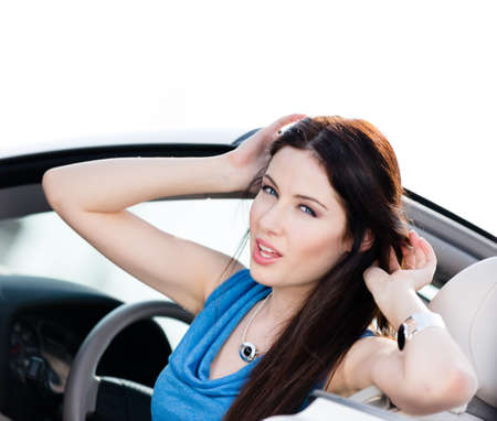 Close up of smiley woman in the convertible car