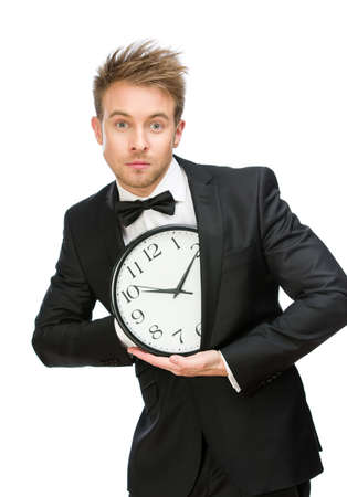 Half-length portrait of businessman hiding clock, isolated on white