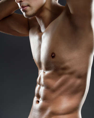 Close up of sportsman's chest, isolated on black