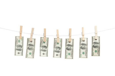 Line of money hanged with clothespins, isolated on whiteの写真素材