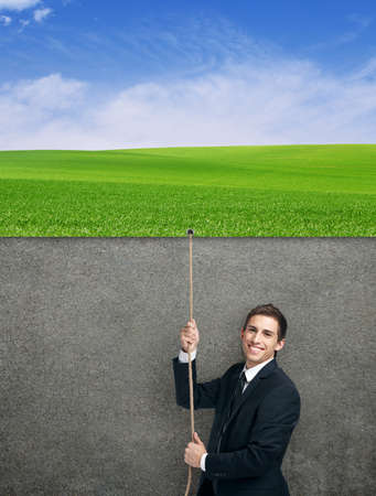 Half-length portrait of businessman swarming up the string with poster, isolated on white. Concept of job promotion and hard workの写真素材