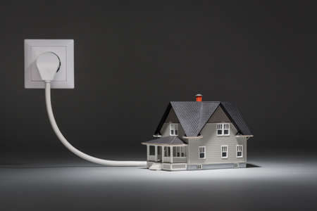 House architectural model connected to electricityの写真素材