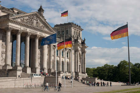 Reichstag with many flags seen from the side