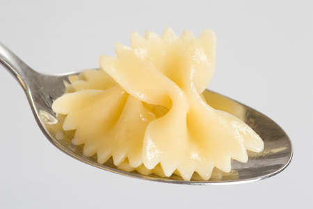 Farfalle with only oil on a tablespoonの写真素材