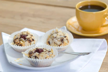 Cherry Tart in paper napkin with coffee cupの写真素材