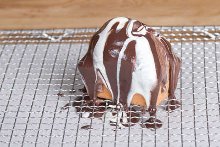 Covered marble cake with brown and white chocolateの写真素材