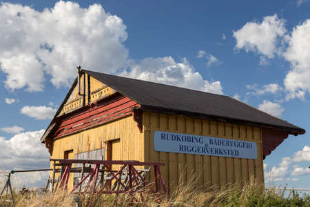 Yellow hat on the shipyard in Rudkbing, Langeland, Denmarkのeditorial素材