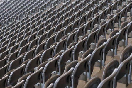 Rows of chairs in a football stadiumの写真素材