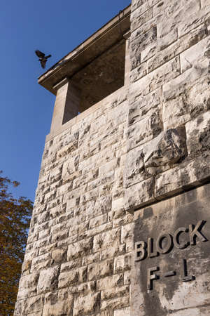 Tribune block F-L with a bird above