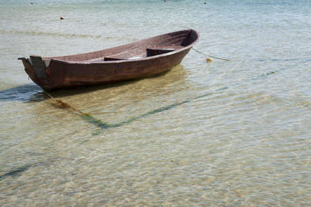 Small rowboat on the shoreの写真素材