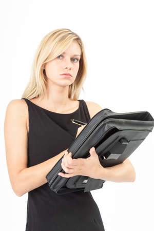 Young woman with wallet on the arm and pen in her handの写真素材