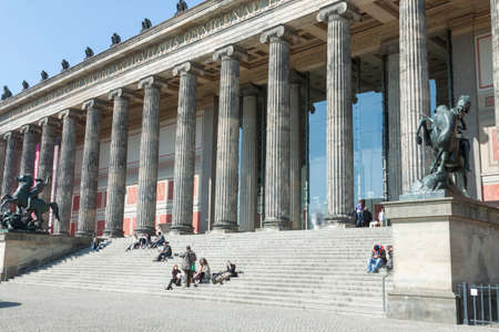 People on the stairs of the old museum in Berlin