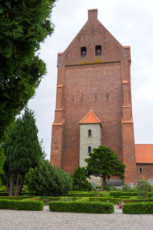 Facade with alcove of the church tower Vaeggerloseの写真素材