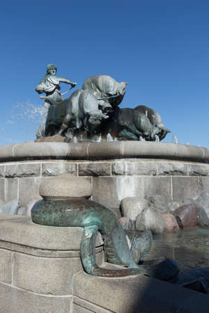 Gefion Fountain in Copenhagen with a snake in the foregroundの写真素材