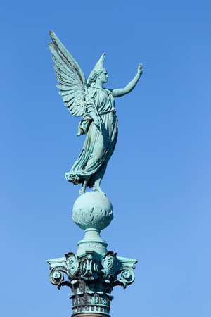 Angel figure on the Ivar Huitfeldt Column in Langelinie Parkの写真素材