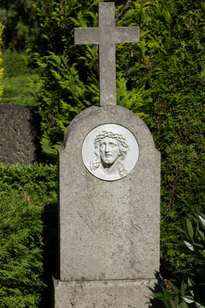 Grave stone without a name with a Jesus-relief