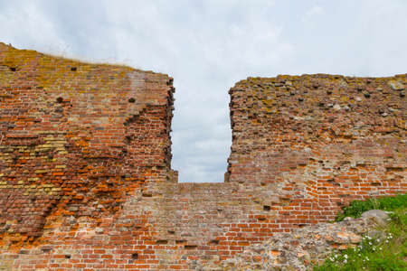 Gap in an old wall of a castle ruin in Denmark Vordingborgの写真素材