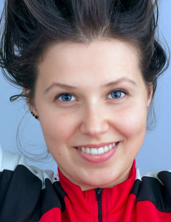 Portrait of a young smiling girl with blue eyes