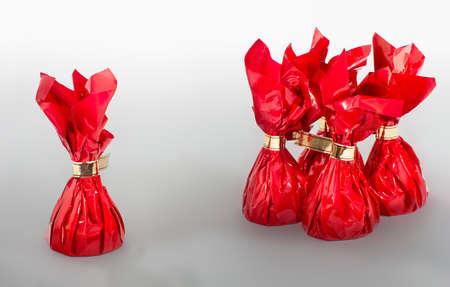 Close view of four plus one red candiesの写真素材