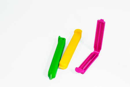 Close view of plastic air proof food bag clamps in a white backgroundの写真素材