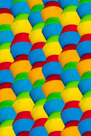 Colorful cupcakes as a background for text writing on the leftの写真素材