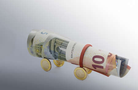 Euro coins and  euro banknotes  in a gradient backgroundの写真素材