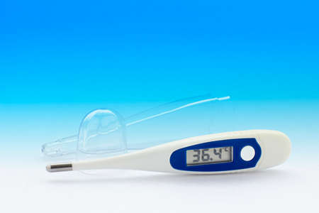 Digital medical thermometer in a blue gradient