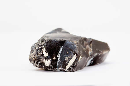 A piece of flint rock in a white backgroundの写真素材