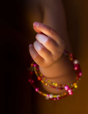 Close view of girl's hand with braceletsの写真素材