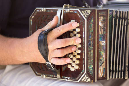 Man playing the bandoneon, traditional tango instrument, Argentina. Close view.の写真素材