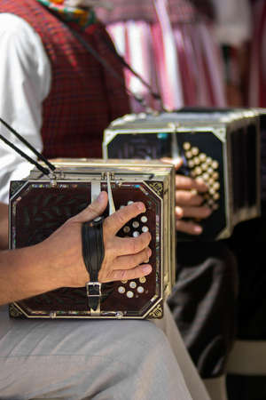 Mans playing the bandoneon, traditional tango instrument, Argentina. Close view.の写真素材