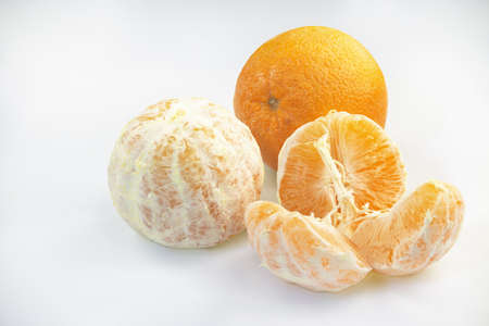 Three orange fruits on a white backgroundの写真素材