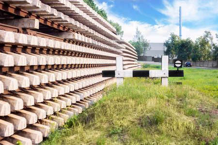 Railroad sign and concrete sleepers in perpectiveの写真素材