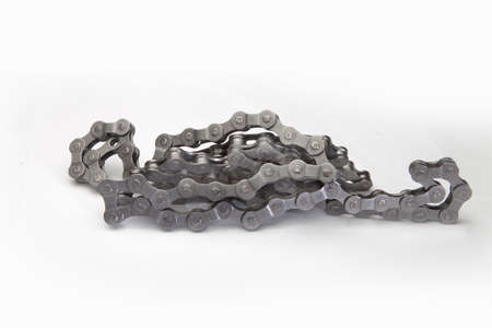 Close view of bicycle chain in a white background