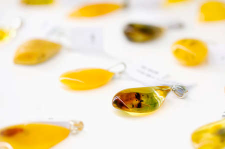 Amber pendant in a blurry backgroundの写真素材
