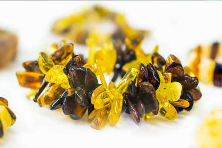 Amber bracelet on a glass in a white backgroundの写真素材