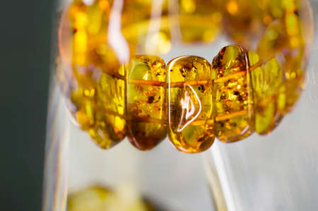 Amber bracelet in  a blurry backgroundの写真素材