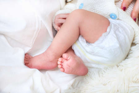 Close view of baby's feet  and pamperの写真素材