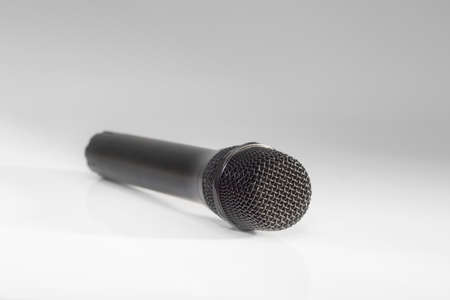 Black metallic microphone on a bright backgroundの写真素材
