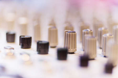 Close view of handle the equalizer on a mixing consoleの写真素材