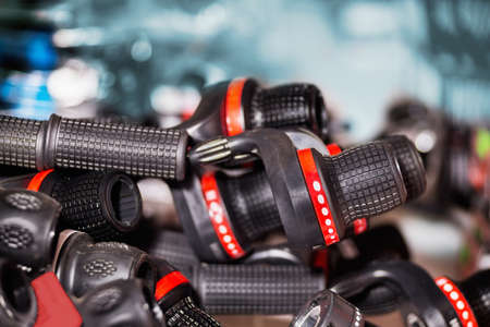 Close view of many bicycle gears shifters and handlebars in on placeの写真素材