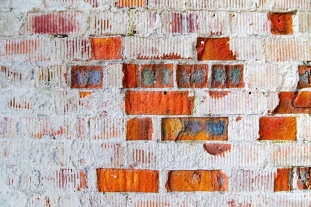 Old red brick wall with cracked bricks surface for background