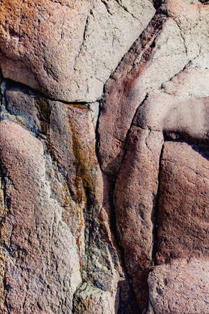 Close up of cracked rock fragment with texture