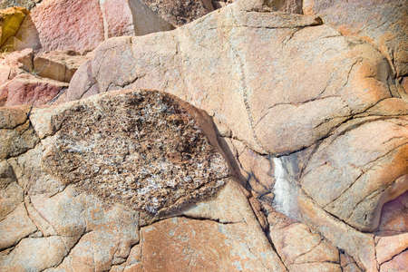 Close up of cracked rock fragment with textureの写真素材