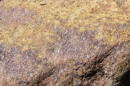 Close up of cracked rock fragment with texture