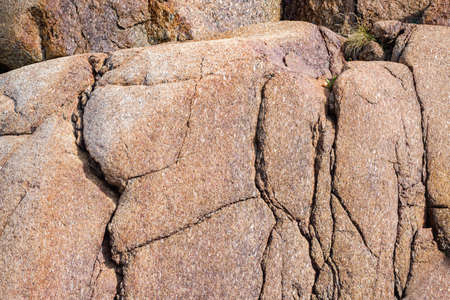 Close up of cracked rock fragment with texture